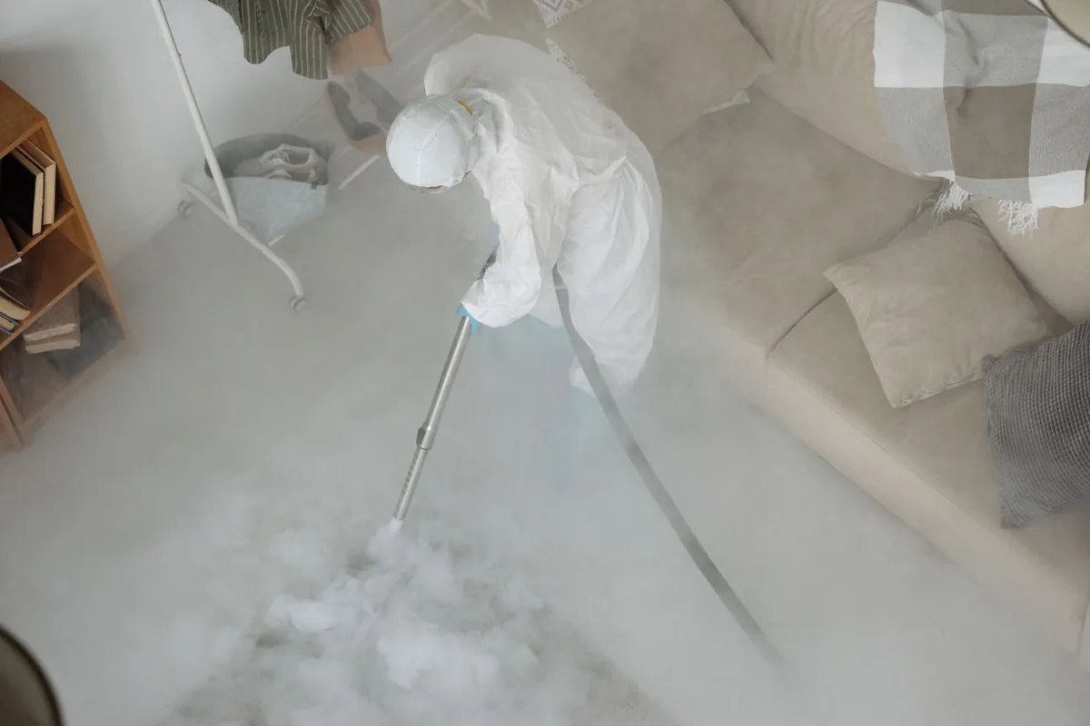 Biohazard cleanup technician in protective equipment, Kings Park, NY